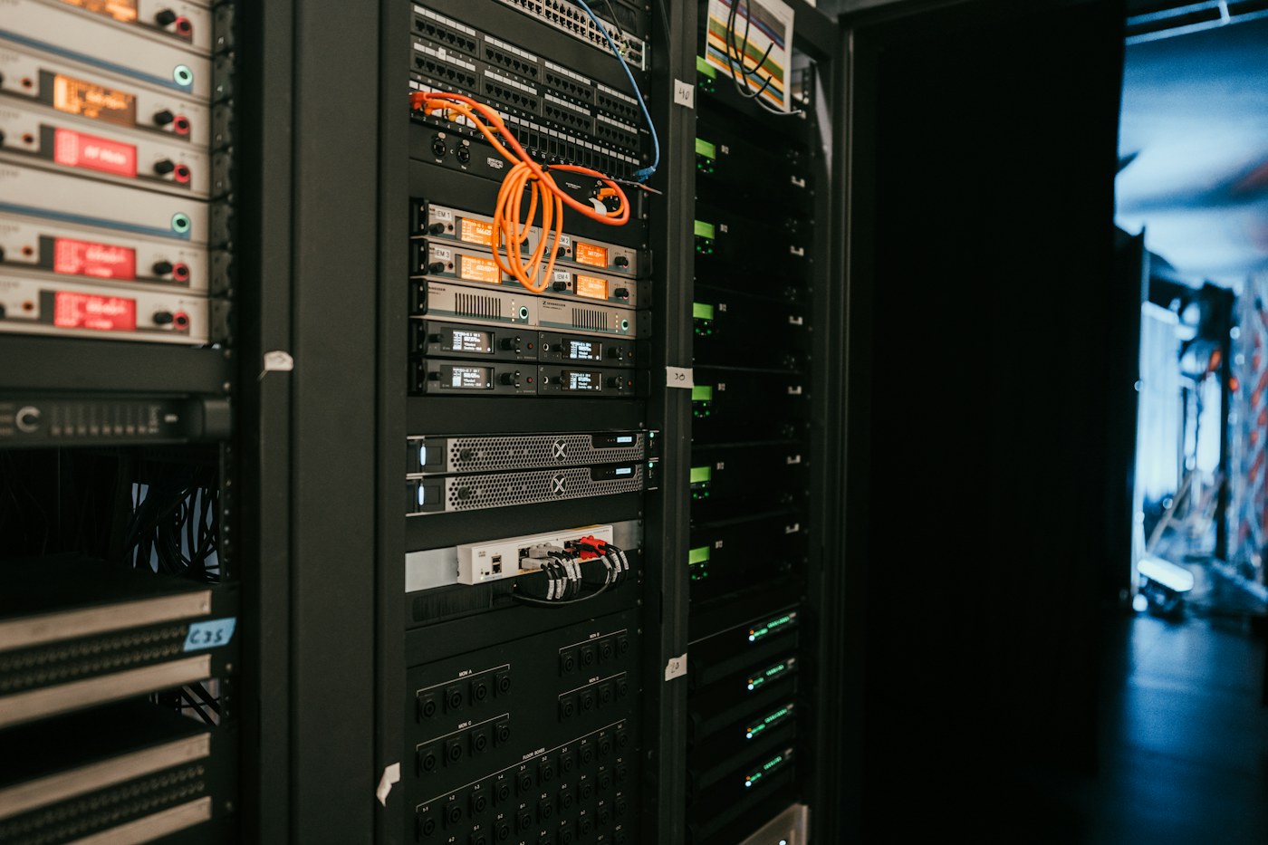 A server rack with networking equipment and neatly arranged cables.